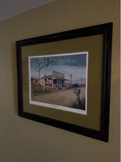 Les C. Kouba “By The Country Store" Framed Print
