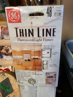 48-inch GE Thin Line Fluorescent Light Fixture designed for plug-in installation [5.1, 5.5].