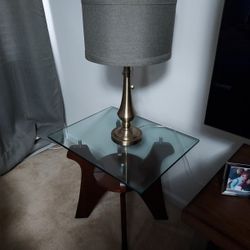 2 wooden table with glass top and 2 rustic bronze finish  lamps
