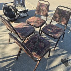 upholstered metal banquet chairs are similar to stacking steel seating designed by brands like Shelby Williams.