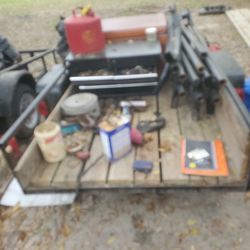 4feet by 8feet dump trailer   with boxes and miscellaneous tools