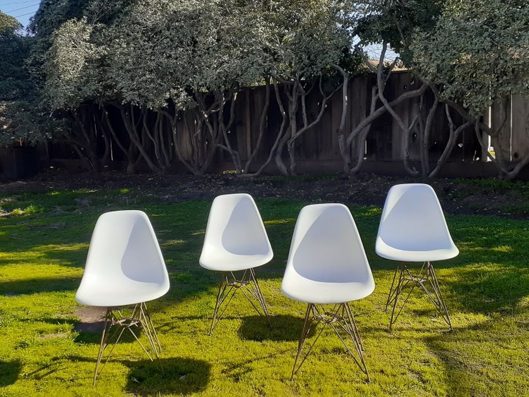 2 Repro Eames Chairs On Brass Color Eiffel Bases