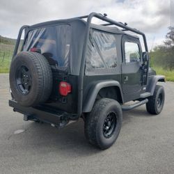 Jeep Wrangler TJ With Roof Rack Tires