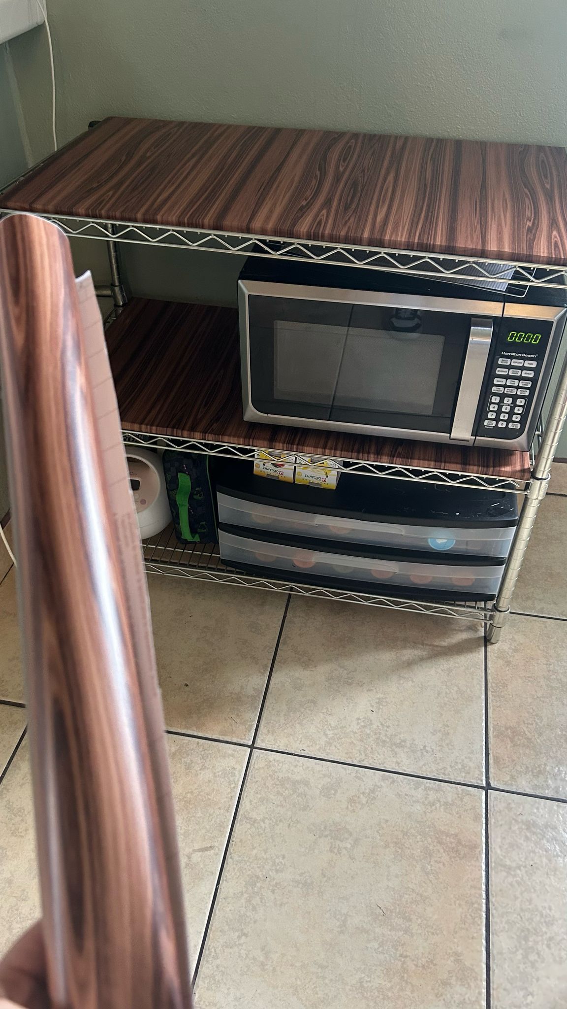 three-tier metal shelving unit