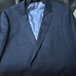 The groomsman navy suit jacket and pants