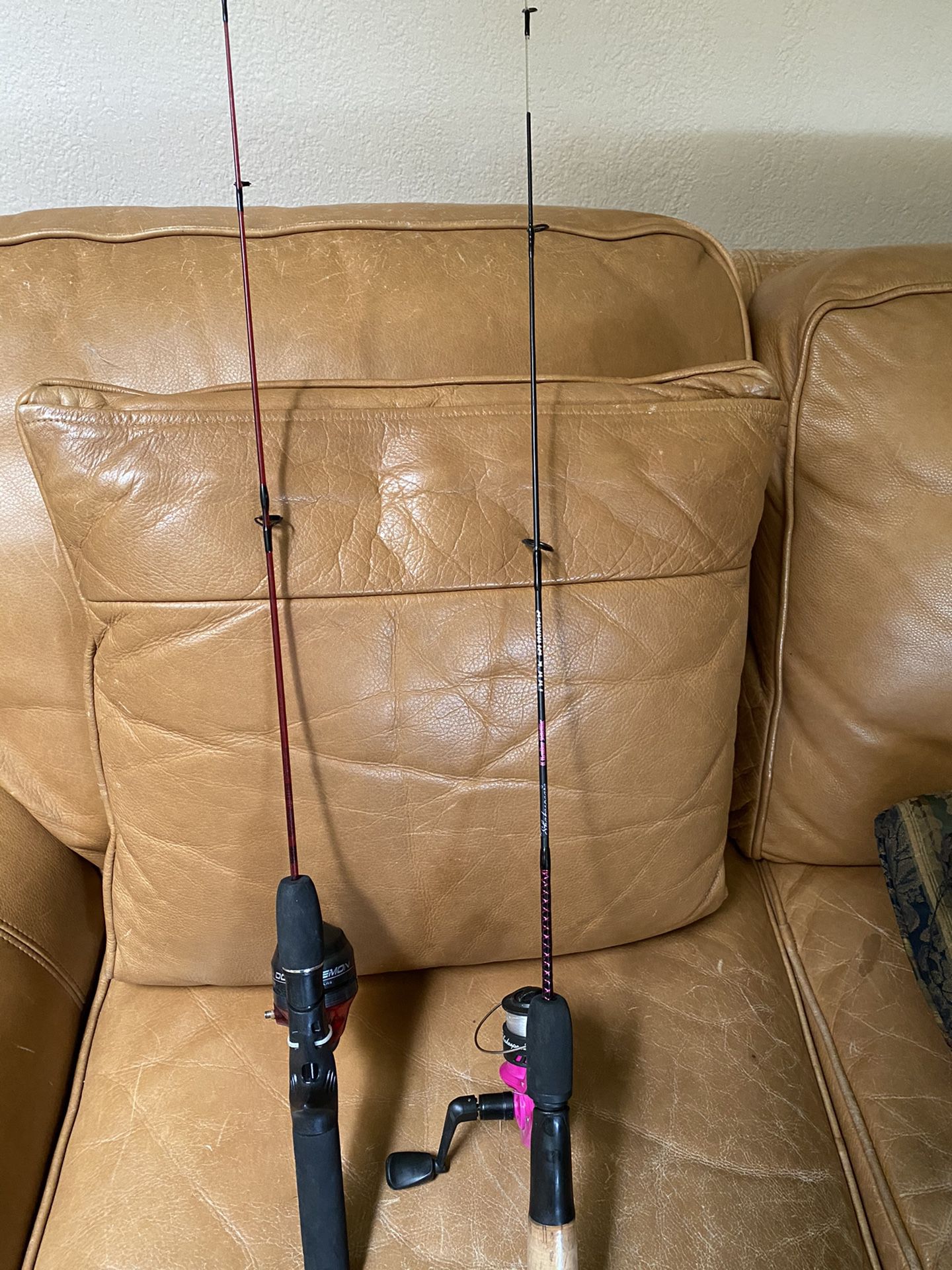 2 children’s fishing poles - one handle is missing off the reel both $10