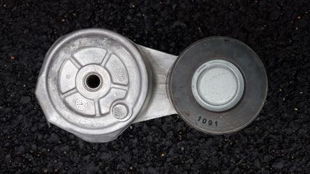CUMMINS ISX AND QSX BELT TENSIONER