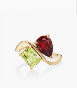 Gold tone ring with red and green stones