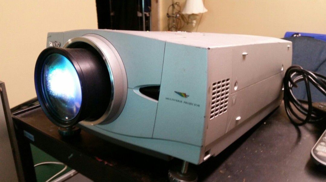 Sanyo video theater projector and 7 feet pull down screen. 