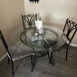 Round Glass Dining Table And Three Chairs 