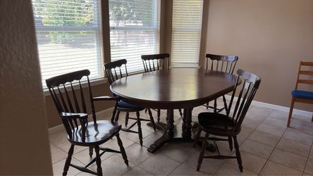 Large wood dining room table with chairs