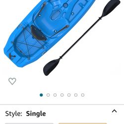 Kayak With Paddle And Life Jacket