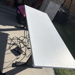 Adjustable charging desk