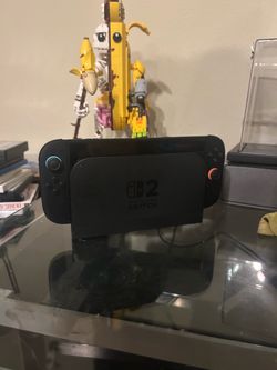Nintendo Switch 2 + 3 games & portable charger