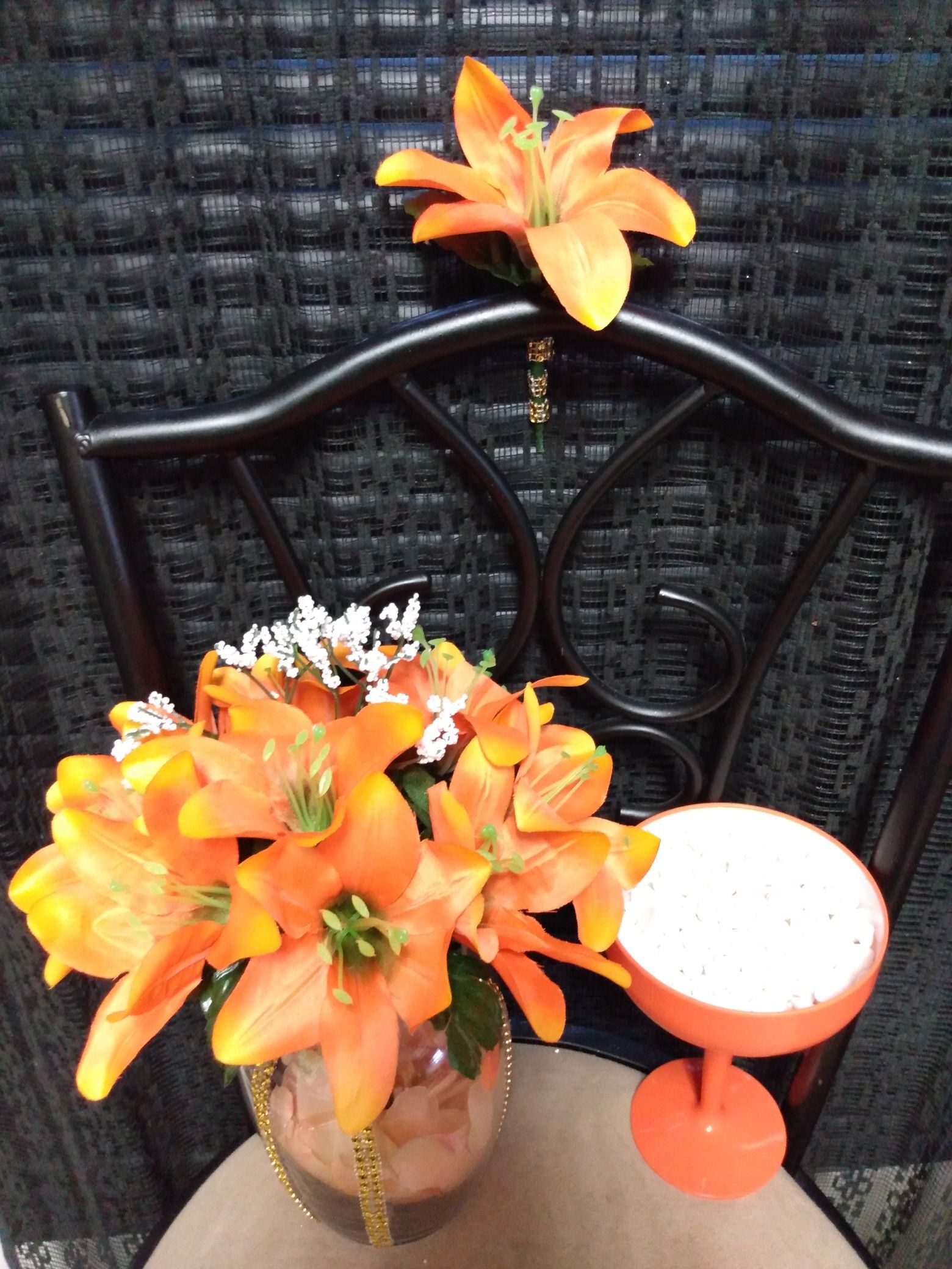 $30 very beautiful UNIQUE all Orange flowers with Gold rhinestones on glass vase. Boutonniere, orange candy cup dish & gift bag location- Solon, Ohio.
