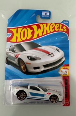 New-in-package die-cast metal and plastic white '11 Corvette Grand Sport from the Hot Wheels Then and Now series. This 1:64 scale model has blue and r