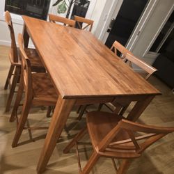 Solid Wood Table And 7 Chairs 
