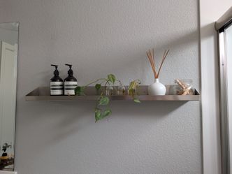 Floating shelf stainless steel brushed metal.  Moving sale