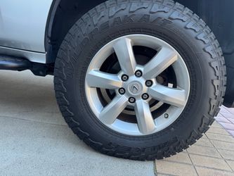 Falken Wildpeak at3w 265/70 r18 on OEM wheels, great full size spare