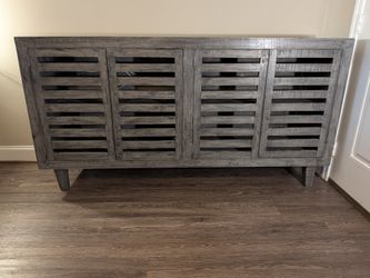 Wood sideboard in a weathered gray finish.