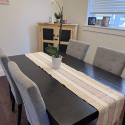 Black Extendable Table With Four Gray Chairs 