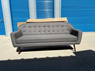 Brand new mid century style sofa, retails for over $1200