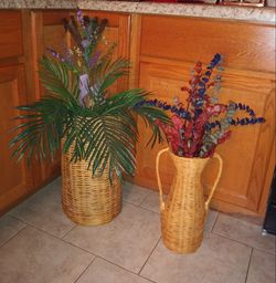 Beautiful flowers in tall pots