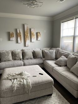 Ashley furniture sectional with ottoman and pillows