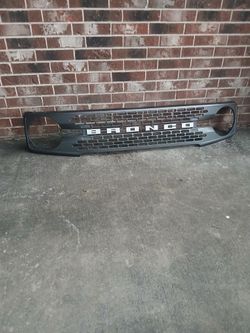OEM Ford Bronco Front Grille (2021-2026) – Carbonized Gray w/ White Letters