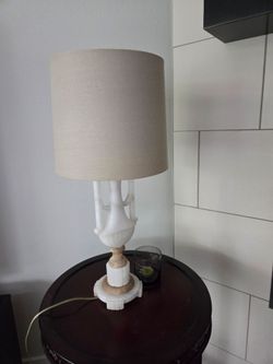 A vintage pair of lamps made by stone.