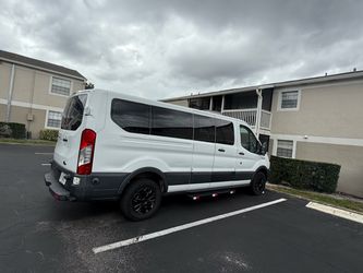 Ford Transit 350, white exterior, gray interior. 14 passengers, 128 mi, very good condition, long distance and local
