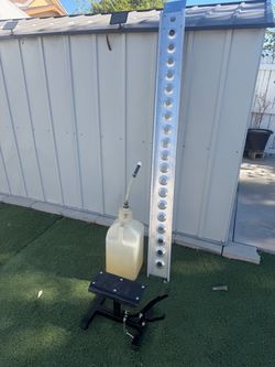 Motorcycle ramp, stand, and gas jug