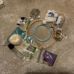 Assorted craft supplies (knitting kit, quilt hoops, beads, and more)