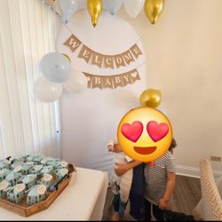 White Backdrop With Baby Decorations 
