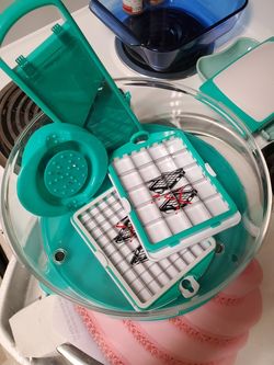 Used 1 time, multi use kitchen tool. Slices, dices, chops, grates and more. 15$