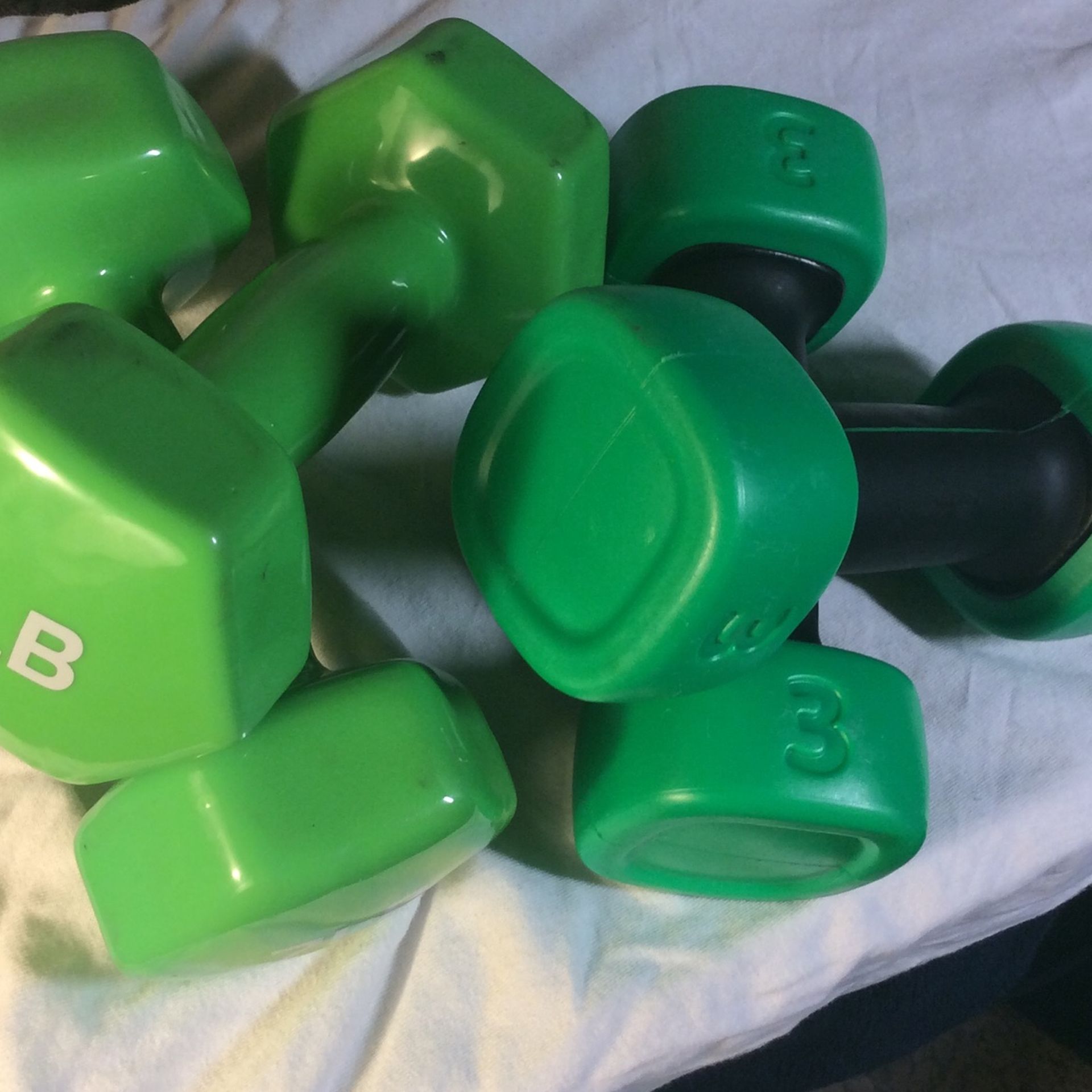 Dumbbells exercise fitness weights 7 pounds and 3 pounds