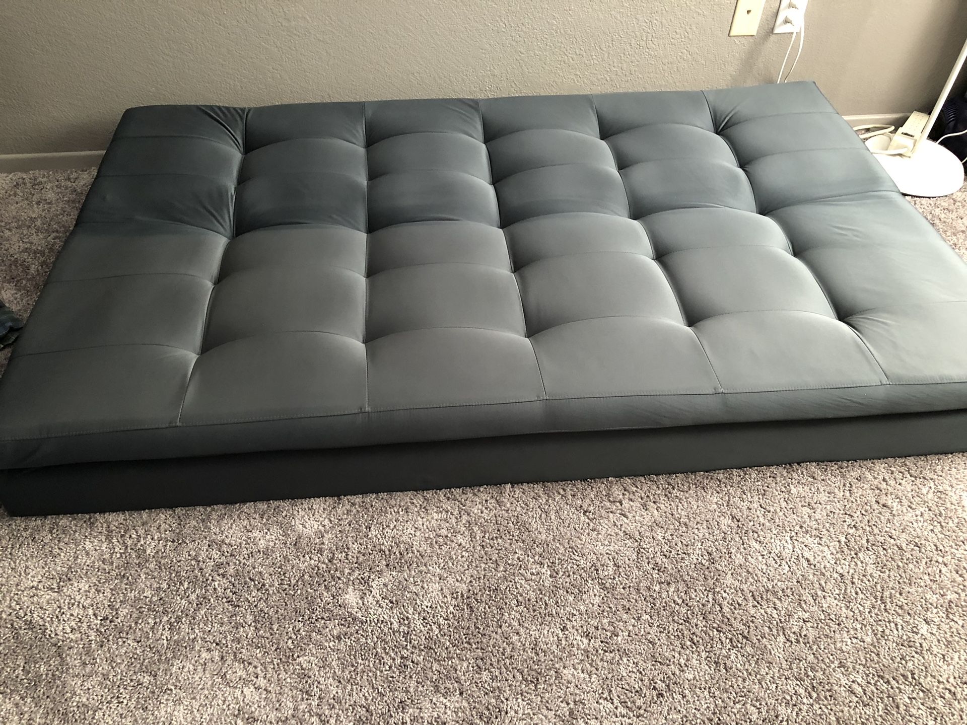 Grey couch/bed with legs - like new