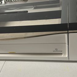 Glowforge Pro 3D laser printer. It is a laser cutting and engraving machine that can be used to create custom projects in a variety of materials.