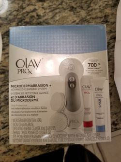 Spa facial brush with two head attachments