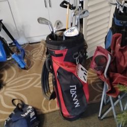 Couple Golf Clubs And Bag