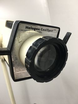 Medical exam lamp light with rolling stand. Tattoo