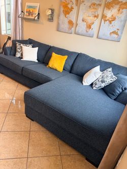 Beautiful dark blue sectional couch with extra wide chaise from Jerome’s