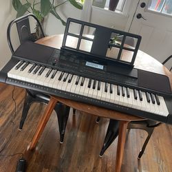 Casio CT-X700 keyboard with included foot pedal and removable music stand