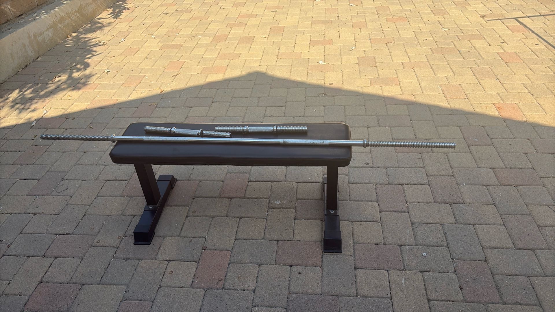 bench, dumbbell weight bar, and barbell