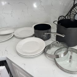 8 serving plates and two Calphalon pots with lids