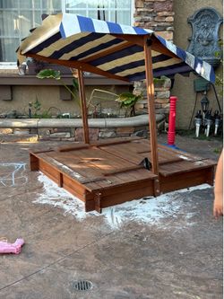 Cute kid sandbox with benches