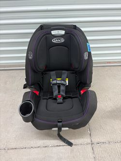 Graco Grows4Me 4-in-1 Car Seat in black.  Designed to transition through four different modes from infancy to booster. 10-position adjustable headrest