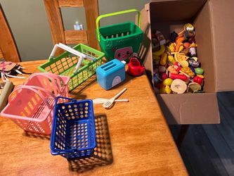 Assorted play food, baskets, and toaster