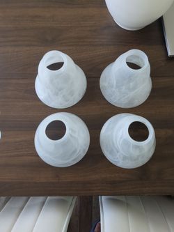 white marbled alabaster glass ceiling fan light shades with a bell-shaped design.