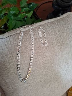 Silver plated set of necklace and bracelet.
